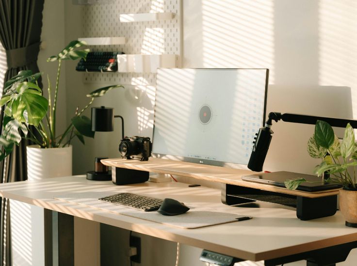 A calm workspace with soft morning light and an organized desk setup
